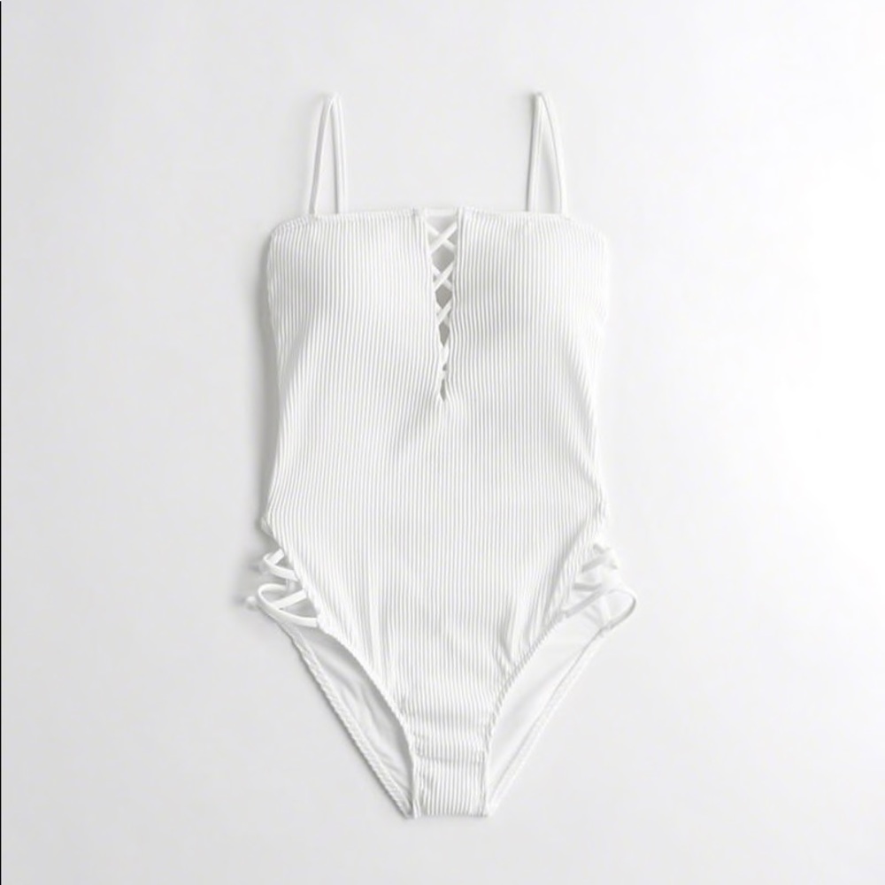 Ribbed Strappy Plunge White one-piece swimsuit.